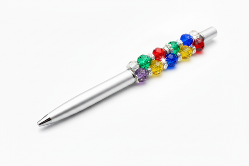 Beadable pen with large glitter beads at the top